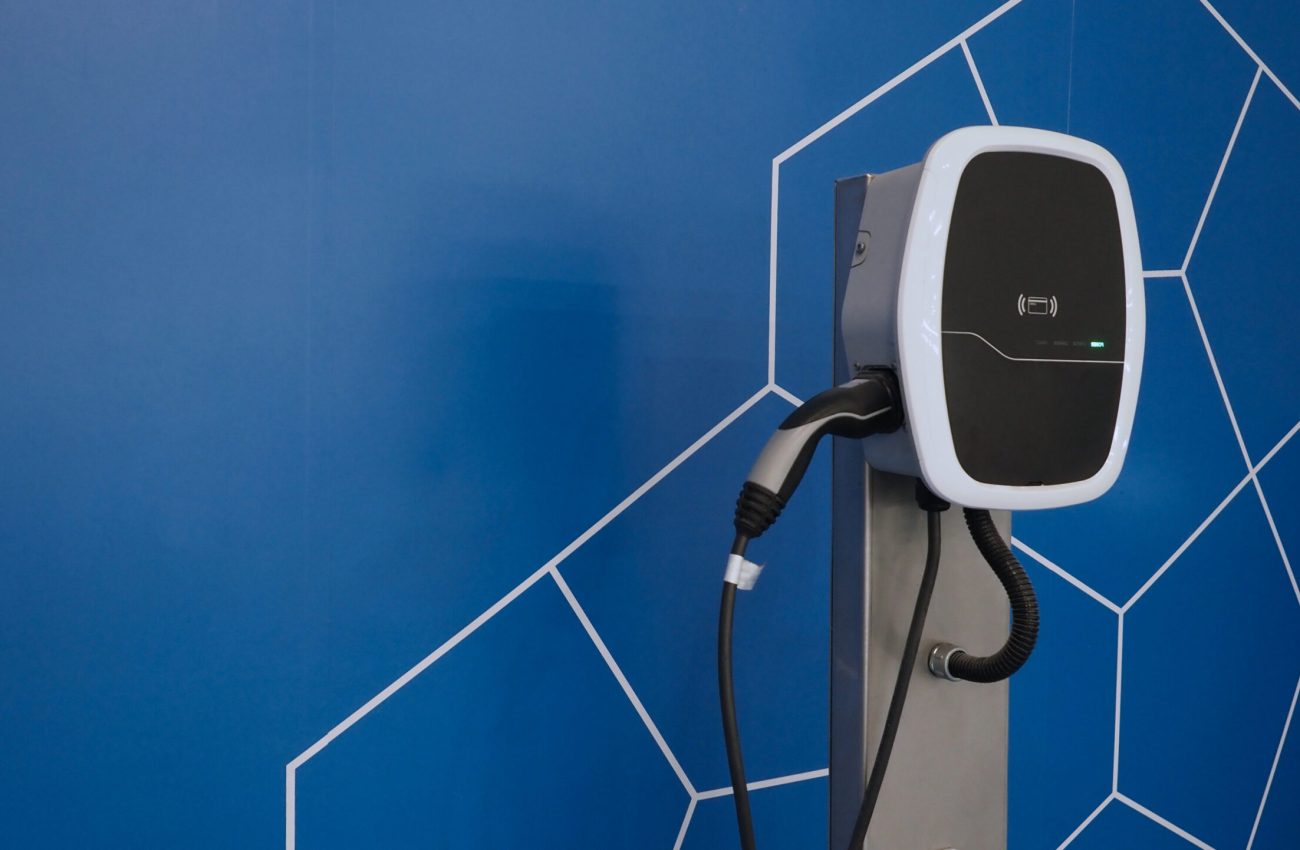 EV Charger quick charge type at car parking which DC Charging faster than AC system. EV Charger car station charging use AC socket plug for electric engine vehicle. Future transport energy technology